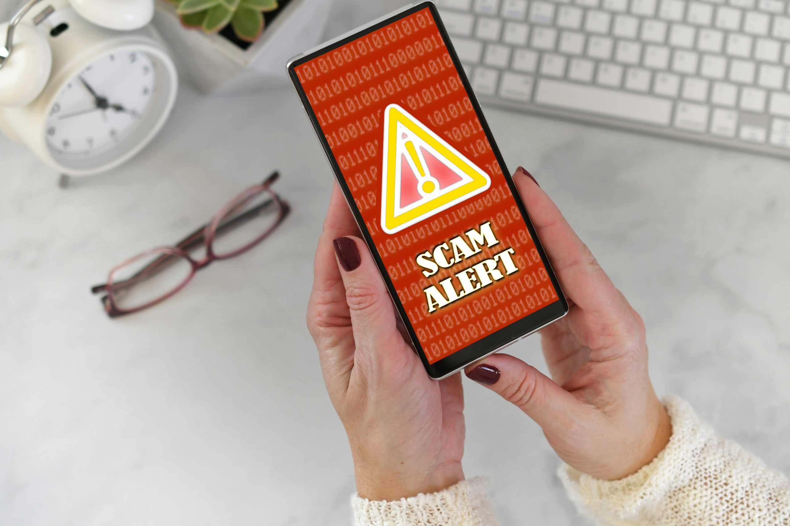 Scam alert on smartphone